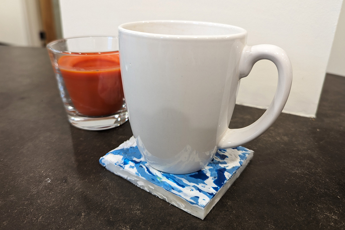 A cup holder made from 100% recycled post-consumer HDPE Products.